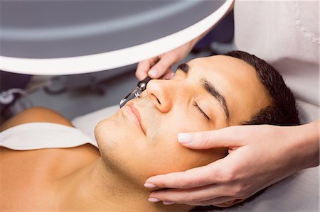 simsearch:6109-08804015,k - Dermatologist performing laser hair removal on patient face in clinic Stock Photo - Premium Royalty-Free, Code: 6109-08803808
