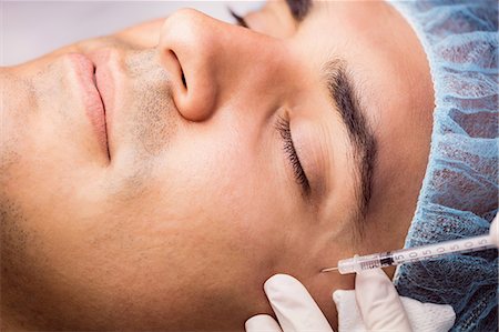 simsearch:6109-08804015,k - Man receiving botox injection on his face at clinic Stock Photo - Premium Royalty-Free, Code: 6109-08803828