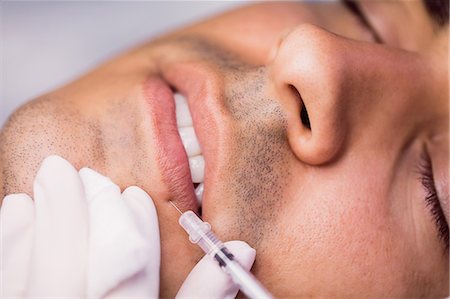simsearch:6109-08804015,k - Man receiving botox injection on his lips at clinic Stock Photo - Premium Royalty-Free, Code: 6109-08803830