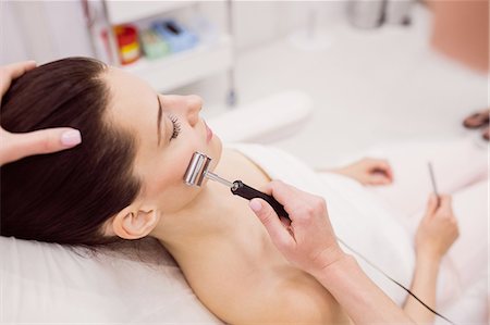 simsearch:6109-08804015,k - Dermatologist performing laser hair removal on patient face in clinic Stock Photo - Premium Royalty-Free, Code: 6109-08804010