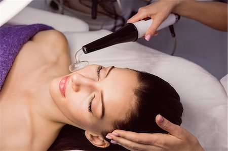 simsearch:6109-08804015,k - Dermatologist performing laser hair removal on patient face in clinic Stock Photo - Premium Royalty-Free, Code: 6109-08804023