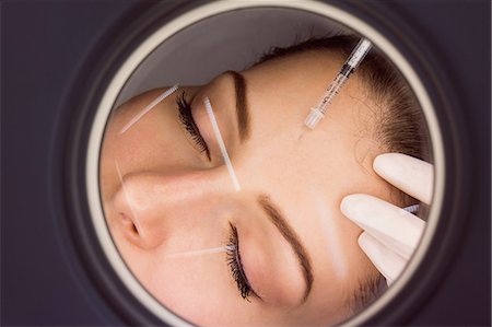 simsearch:6109-08804015,k - Female patient receiving an injection on her face in clinic Stock Photo - Premium Royalty-Free, Code: 6109-08804033