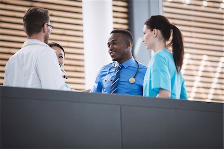 simsearch:6109-08804356,k - Doctors and nurse interacting with each other in hospital Stock Photo - Premium Royalty-Free, Code: 6109-08804345