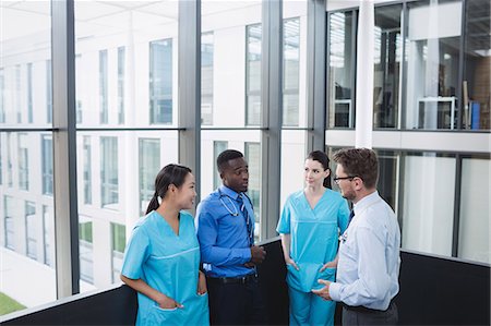 simsearch:6109-08804356,k - Doctors and nurse interacting with each other in hospital Stock Photo - Premium Royalty-Free, Code: 6109-08804348