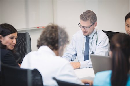 simsearch:6109-08804356,k - Team of doctors in meeting at conference room Stock Photo - Premium Royalty-Free, Code: 6109-08804367