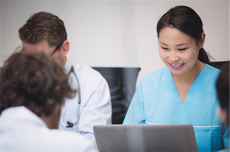 simsearch:6109-08804356,k - Nurse using laptop in conference room at hospital Stock Photo - Premium Royalty-Free, Code: 6109-08804366