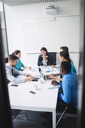 simsearch:6109-08804356,k - Team of doctors in a meeting at conference room Stock Photo - Premium Royalty-Free, Code: 6109-08804374