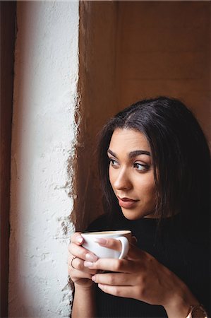 simsearch:6113-07790833,k - Beautiful woman having a cup of coffee in café̩ Stock Photo - Premium Royalty-Free, Code: 6109-08830381