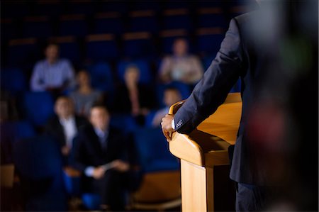 Mid section of male business executive giving a speech Stock Photo - Premium Royalty-Free, Code: 6109-08830486
