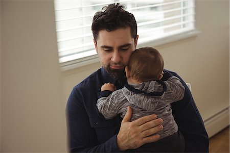 simsearch:632-08001820,k - Father comforting his baby at home Stock Photo - Premium Royalty-Free, Code: 6109-08944716