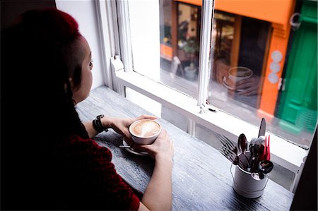 simsearch:6113-07790833,k - Thoughtful woman having coffee in café Stock Photo - Premium Royalty-Free, Code: 6109-08944941