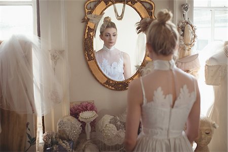 simsearch:700-03696805,k - Young bride in a white dress looking into mirror in a boutique Stock Photo - Premium Royalty-Free, Code: 6109-08945254