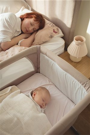 simsearch:6102-08566788,k - High angle view of mother and baby sleeping in bedroom at home Stock Photo - Premium Royalty-Free, Code: 6109-08945222