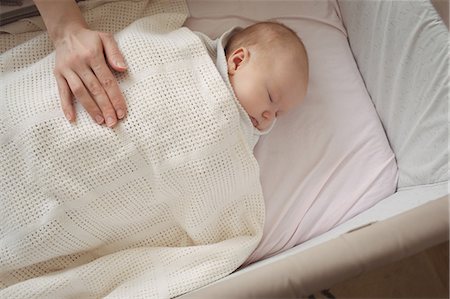 simsearch:6102-08566788,k - High angle view of mother hand on sleeping baby at home Stock Photo - Premium Royalty-Free, Code: 6109-08945228