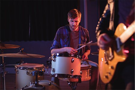 pianist - Drummer playing drums in recording studio Stock Photo - Premium Royalty-Free, Code: 6109-08953723