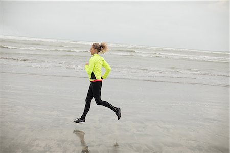 simsearch:6109-06003758,k - Beautiful woman jogging on the beach Stock Photo - Premium Royalty-Free, Code: 6109-08953862