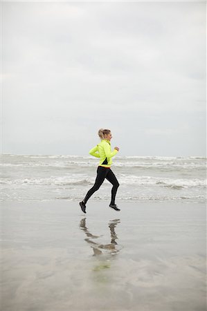 simsearch:6109-06003758,k - Beautiful woman jogging on the beach Stock Photo - Premium Royalty-Free, Code: 6109-08953864