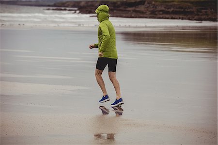 simsearch:400-04535435,k - Rear view of athlete running on the beach Stock Photo - Premium Royalty-Free, Code: 6109-08928445