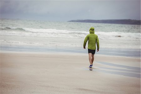 simsearch:628-05817723,k - Rear view of athlete running on the beach Stock Photo - Premium Royalty-Free, Code: 6109-08928446
