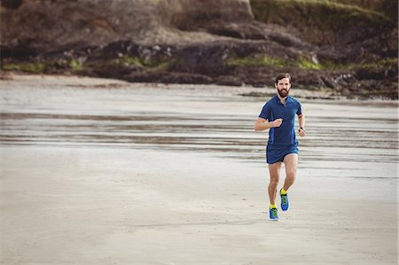 simsearch:400-04535435,k - Handsome athlete running on the road Stock Photo - Premium Royalty-Free, Code: 6109-08928506