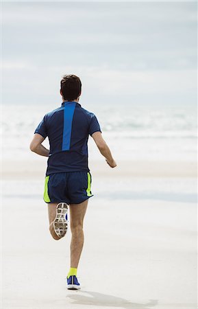 simsearch:6109-06003758,k - Rear view of athlete running on the beach Stock Photo - Premium Royalty-Free, Code: 6109-08928512