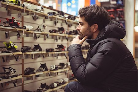 simsearch:649-07063808,k - Handsome man selecting ski binding in a shop Stock Photo - Premium Royalty-Free, Code: 6109-08928914