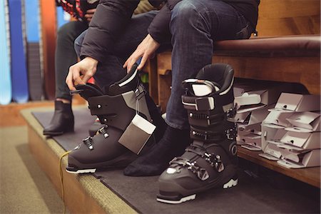 fashion men shoes - Close-up of man wearing a ski boot in a shop Stock Photo - Premium Royalty-Free, Code: 6109-08928918