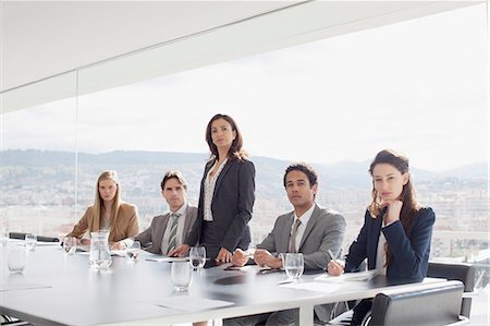Portrait of serious business people at table in conference room Stock Photo - Premium Royalty-Free, Code: 6113-06497883