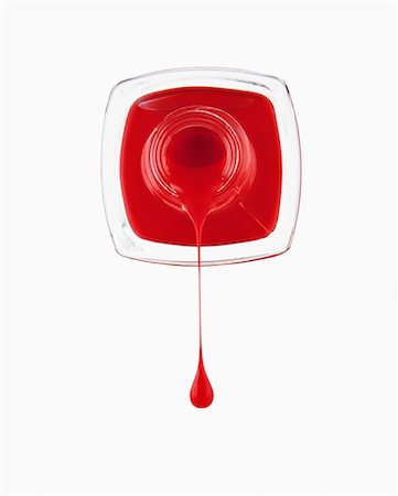 droplet - Close up of red fingernail polish dripping from bottle Stock Photo - Premium Royalty-Free, Code: 6113-06497980