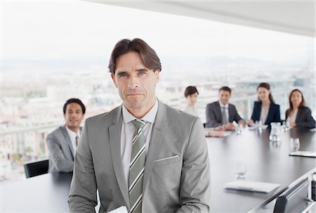 Portrait of confident business people in conference room Stock Photo - Premium Royalty-Free, Code: 6113-06497900