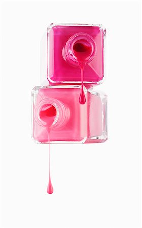 dripping silhouette - Close up of pink fingernail polish dripping from bottles Stock Photo - Premium Royalty-Free, Code: 6113-06498023