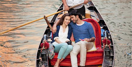 Smiling couple riding in gondola in Venice Stock Photo - Premium Royalty-Free, Code: 6113-06498174