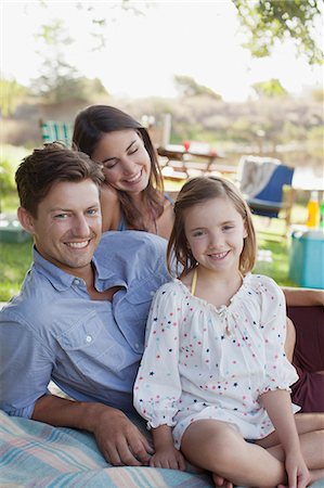 simsearch:6113-06498556,k - Portrait of smiling family picnicking at lakeside Stock Photo - Premium Royalty-Free, Code: 6113-06498578