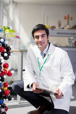 doctor white coat full body - Portrait of smiling scientist in laboratory Stock Photo - Premium Royalty-Free, Code: 6113-06498859