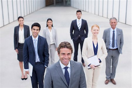 Portrait of smiling business people Stock Photo - Premium Royalty-Free, Code: 6113-06498827