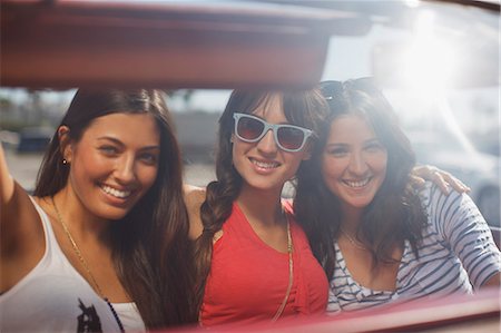 people in vintage convertibles - Smiling women driving convertible Stock Photo - Premium Royalty-Free, Code: 6113-06498956