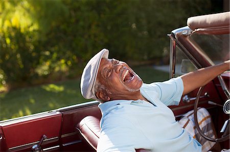 Laughing older man driving convertible Stock Photo - Premium Royalty-Free, Code: 6113-06498964