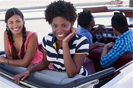 people in vintage convertibles - Smiling women sitting in convertible Stock Photo - Premium Royalty-Free, Code: 6113-06498934