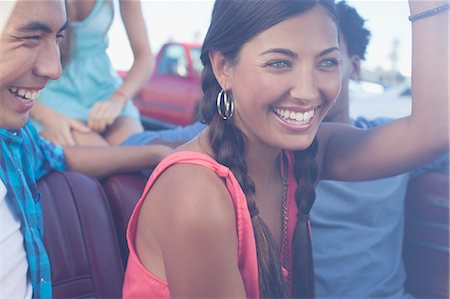 people in vintage convertibles - Smiling friends riding in convertible Stock Photo - Premium Royalty-Free, Code: 6113-06498938