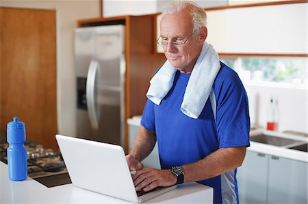 fitness man exhausting - Older man using laptop after workout Stock Photo - Premium Royalty-Free, Code: 6113-06499097