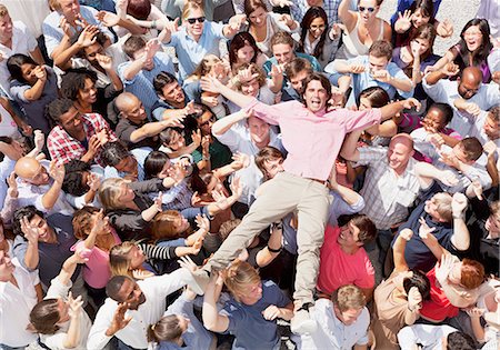 simsearch:6113-06499188,k - Portrait of enthusiastic man crowd surfing Stock Photo - Premium Royalty-Free, Code: 6113-06499170