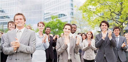 simsearch:6113-06499188,k - Portrait of clapping business people in crowd Stock Photo - Premium Royalty-Free, Code: 6113-06499190