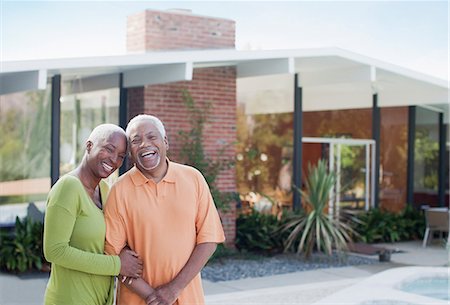 Older couple smiling in backyard Stock Photo - Premium Royalty-Free, Code: 6113-06499122