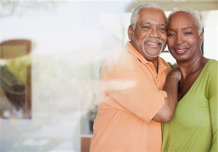 simsearch:6113-06498180,k - Older couple smiling by window Stock Photo - Premium Royalty-Free, Code: 6113-06499129