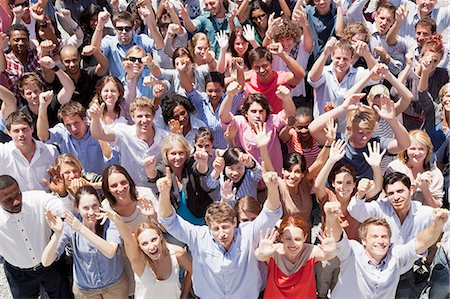 sports fans male - Portrait of crowd cheering with arms raised Stock Photo - Premium Royalty-Free, Code: 6113-06499203