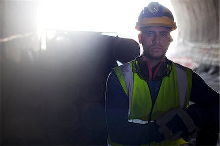 Worker standing in tunnel Stock Photo - Premium Royalty-Free, Code: 6113-06625854