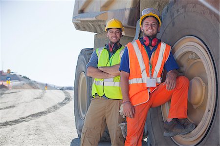 Workers leaning on machinery on site Stock Photo - Premium Royalty-Free, Code: 6113-06625947