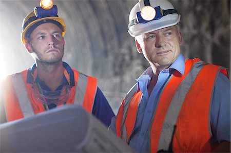 Worker and businessman with blueprints in tunnel Stock Photo - Premium Royalty-Free, Code: 6113-06625959