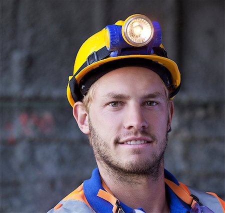 Close up of worker's smiling face Stock Photo - Premium Royalty-Free, Code: 6113-06625933