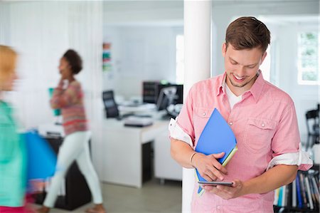 small business computers - Businessman using digital tablet in office Stock Photo - Premium Royalty-Free, Code: 6113-06626087